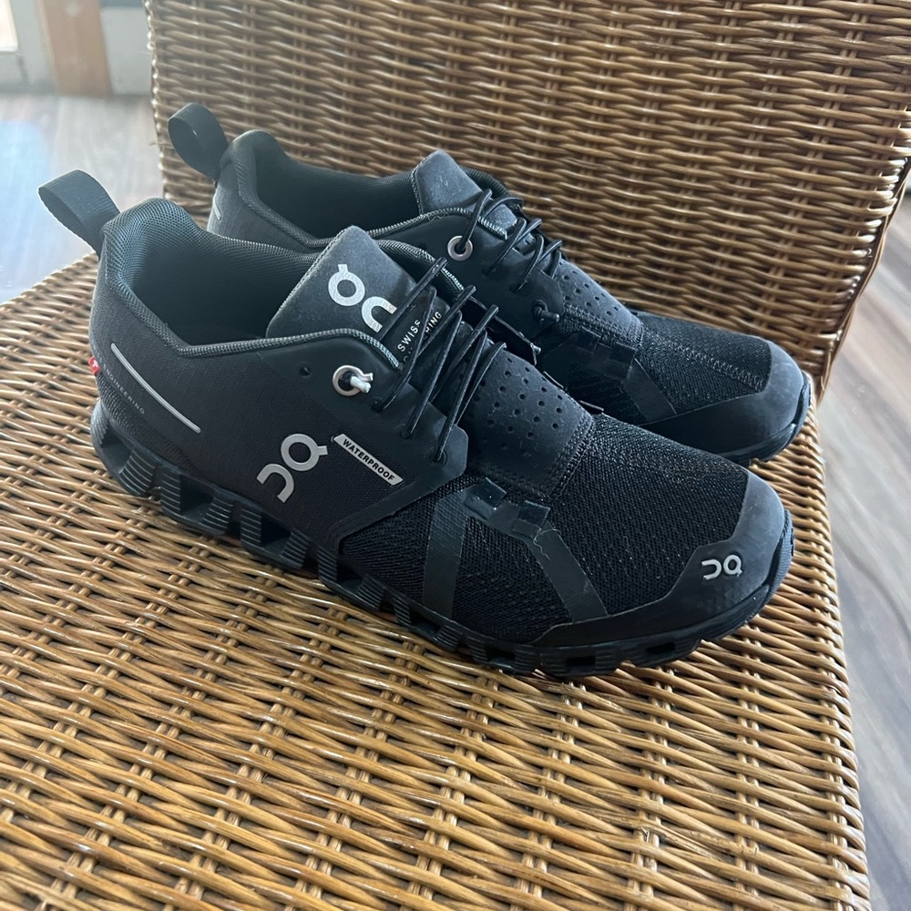 Black QC tennis shoes
